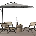Outdoor Rattan Table And Chair Set With Umbrella On Wooden Deck