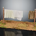 Rustic Clothesline Setup With Wooden Poles Hanging White And Brown Fabrics On Grass Dirt Ground