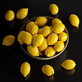 Fresh Ripe Yellow Lemons in Ceramic Bowl Scattered Around Black Surface