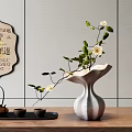 Modern Vase With White Blossoms And Green Leaves On Wooden Tabletop With Tea Set