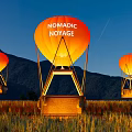 Nomadic Noyage Hot Air Balloons Soaring Over Mountain And Rural Green Field
