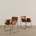 Brown Leather Leisure Chairs with Metal Frame on Wooden Floor Light Wall Background