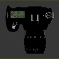 Professional Digital Camera With Black Body And Green Lens Reflection