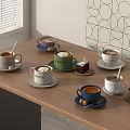 Various Coffee Cups With Unique Designs On Wooden Table Alongside Mini Pastries And Wall Art