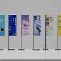 Different Advertising Display Stands With Various Promotional Posters And Content