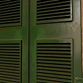 Green Casement Windows With Wooden Frames Glass Panels And Shutter Design