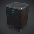 Black Digital Speaker With Circular Top Grille Green Indicator Side Buttons And Bottom Feet