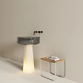Contemporary Glass Washbasin With White Pedestal Black Faucet Small Table Rolled Towels Light Colored Background