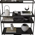 Modern Black Metal Multi Tiered Shelf With Decorative Vases Books And Candle Holder