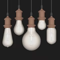 Vintage Pendant Lights With Brown Base And Transparent Bulbs In Various Sizes On Black Background