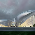 Modern Museum Building Featuring Curved Silver Metal Structure and Glass Facade under Pink Cloudy Sky