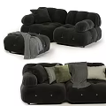 Soft Black Sectional Sofa With Plush Pillows Ottoman And Cozy Blanket