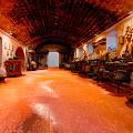 Traditional Cultural Center With Arched Ceiling Red Floor Wall Decorations And Artifacts