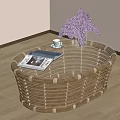 Oval Rattan Coffee Table With Magazine Small Cup And Purple Flowers In Living Room