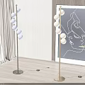 Modern Floor Lamps With Spherical Bulbs In Living Interior With Abstract Art And Green Plant