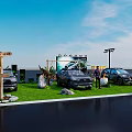Outdoor Vehicle Display Event With Multiple Cars On Grass And Decorative Lights