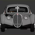 Silver Vintage Classic Car With Streamlined Body And Retro Headlights