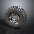 Truck Tire With Deep Tread Pattern And Metal Rim On Dark Background