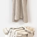 White Washing Machine With Freshly Laundered Soft Towels And Hanging Robes