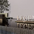 Modern Facade Entrance With LEGEND JUBILANT Golden Signage Gray Wall Trees And Waterfall