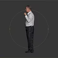 Man In White Shirt And Dark Pants Standing With Fist Raised Against Grey Background