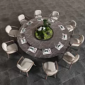 Round Marble Top Dining Table With Ten Light Colored Chairs And Green Plant Tableware