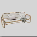 Stylish Outdoor Rattan Bench With Plain And Geometric Pattern Cushions And Woven Blanket