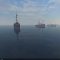Vintage Warships Sailing On Calm Sea With Cloudy Sky And Reflections