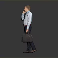 Businessman Talking on Phone in Light Blue Shirt Holding Gray Briefcase Against Gray Background
