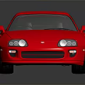 Red Two Door Sports Car With Rear Spoiler Silver Wheels And Reflection