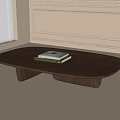 Oval Wooden Coffee Table With Two Books In Room With Window And Wall Molding