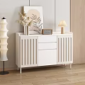 Modern White Sideboard with Decorative Vase Plant Table Lamp and Radio in Stylish Interior