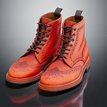 Stylish Orange Leather Brogue Boots With Black Laces And Intricate Patterns
