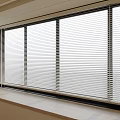 Modern Interior Design With Stylish Venetian Blinds On Large Window Allowing Natural Light