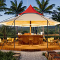 Red Top White Tent With Outdoor Bar And Palm Trees In Natural Setting