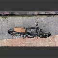 Stylish Black Motorcycle Displayed On Stand With Colorful Graffiti Wall Background