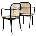 Elegant Modern Leisure Chairs With Black Metal Frames And Woven Rattan Seats Backs