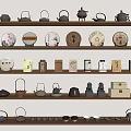 Traditional Tea Utensils Display with Teapots Teacups and Round Tea Cakes on Shelves
