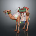 Ornate Decorated Camel With Green Saddle Patterned Blanket And Colorful Tassels