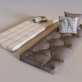 Soft Upholstered Cushions In Beige And Brown With Checkered Pillow And Stacked Books