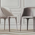 Modern Leisure Chairs With Curved Armrests And Upholstered Seats In Neutral Tones