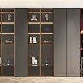 Elegant Modern Dark Gray Bookcase With Glass Doors Golden Frames And Decor Items