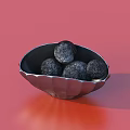 Ceramic Shell Shaped Bowl With Silver Finish Holding Black Round Objects On Red Background 3d model