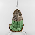 Rattan Hanging Chair With Green Cushion And Woven Design For Comfortable Relaxation