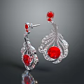 Elegant Silver Earrings With Red Gemstones And Decorative Metal Design