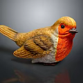 Vibrant Bird Sculpture With Orange Chest Yellow Head Wings On Reflective Grey Surface