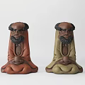 Artistic Sculpture Carving Featuring Bearded Human Figures In Brown Green Color And Sitting Pose
