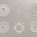 Intricate Carved Plaster Ornaments Featuring Various Circular And Snowflake Ceiling Designs