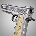 Intricately Engraved Silver Pistol Featuring Decorative Wooden Grip And Floral Patterns