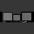 Three Vintage Black Monitors Of Various Sizes With Retro Electronic Accessories